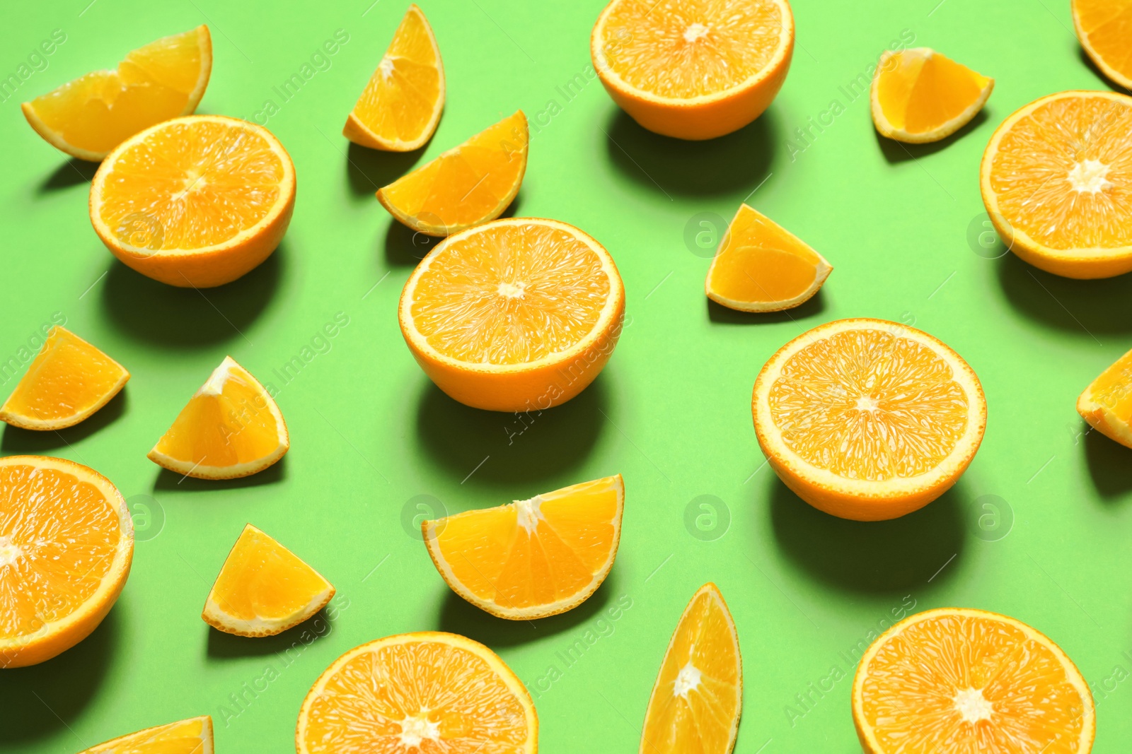 Photo of Composition with ripe oranges on color background