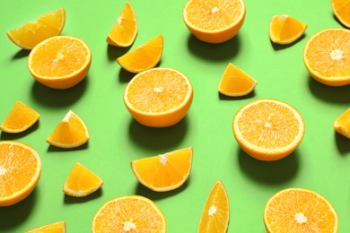 Photo of Composition with ripe oranges on color background