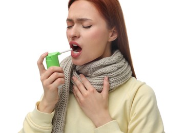 Photo of Young woman with scarf using throat spray on white background