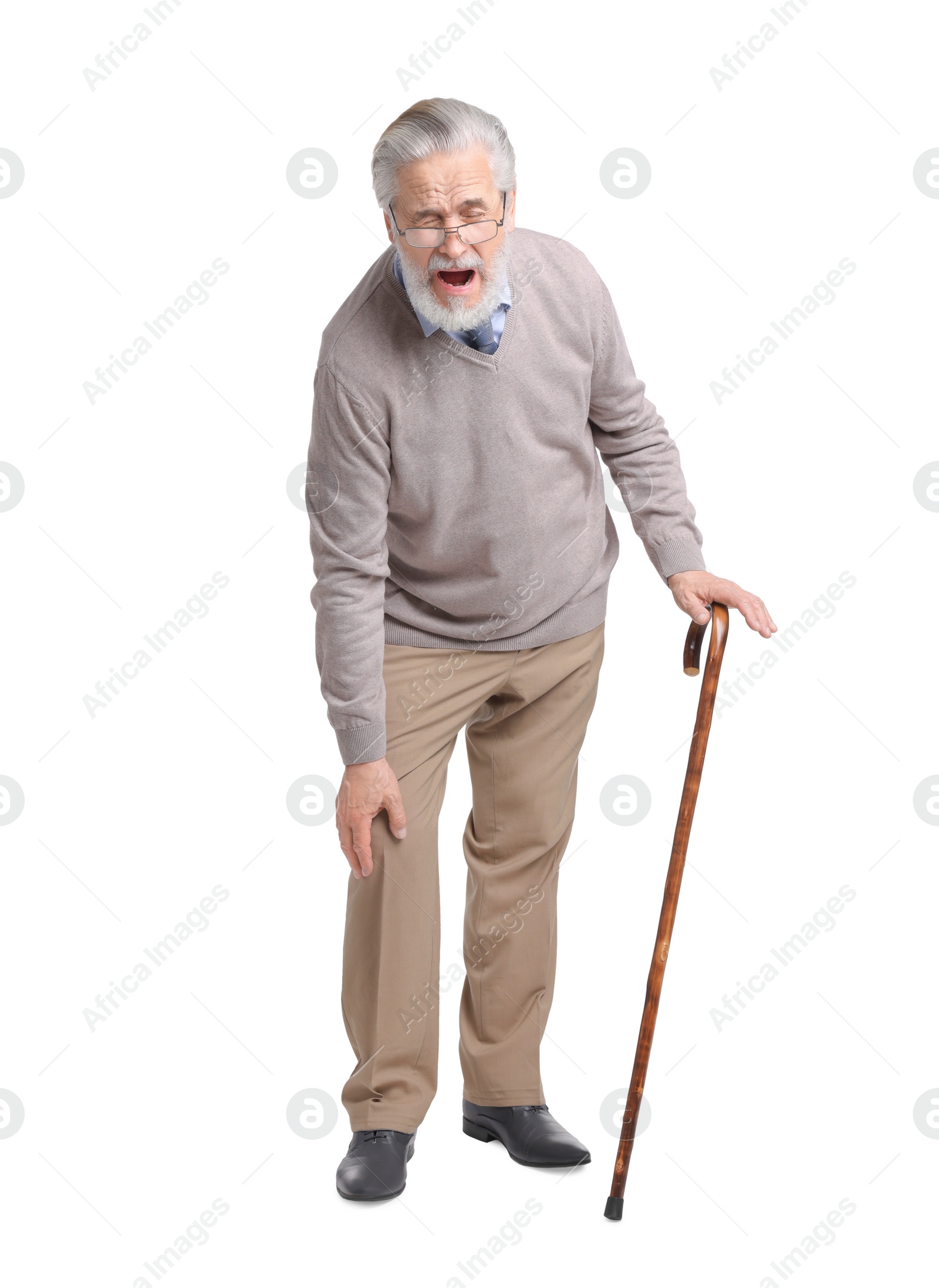 Photo of Senior man with walking cane suffering from knee pain on white background