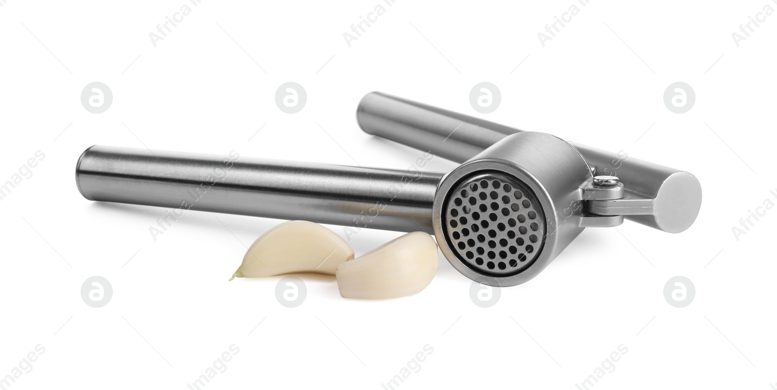 Photo of One metal garlic press and cloves isolated on white