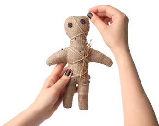 Photo of Woman stabbing voodoo doll with pin on white background, closeup