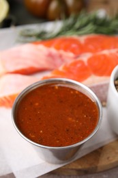 Tasty fish marinade in bowl on table, closeup