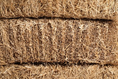 Bales of dried straw as background, closeup