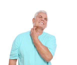 Mature man scratching neck on white background. Annoying itch