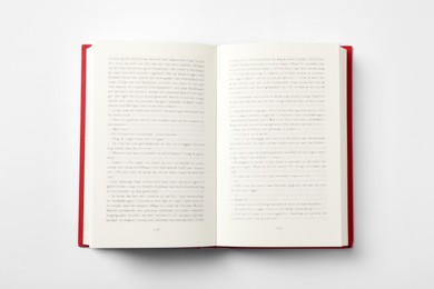 Photo of Open book on white background, top view