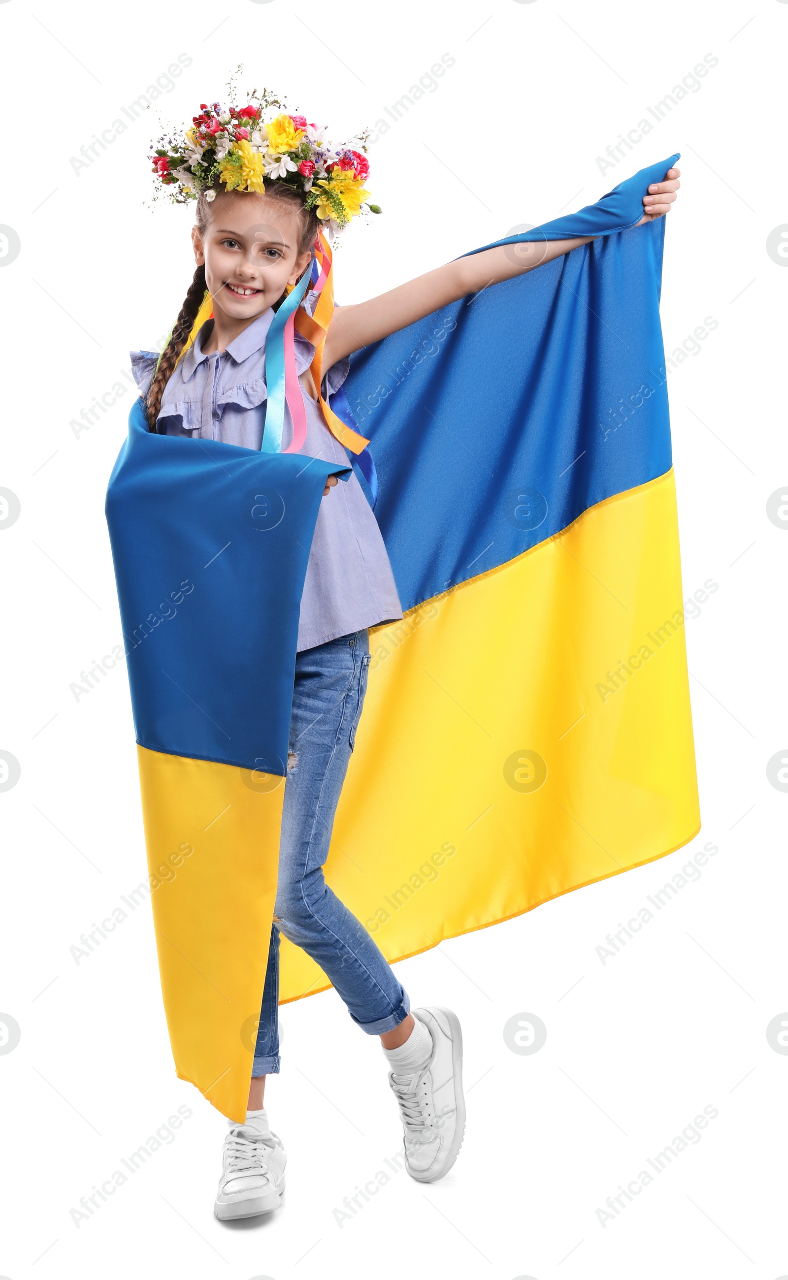 Photo of Girl in flower wreath with flag of Ukraine on white background