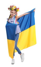 Girl in flower wreath with flag of Ukraine on white background