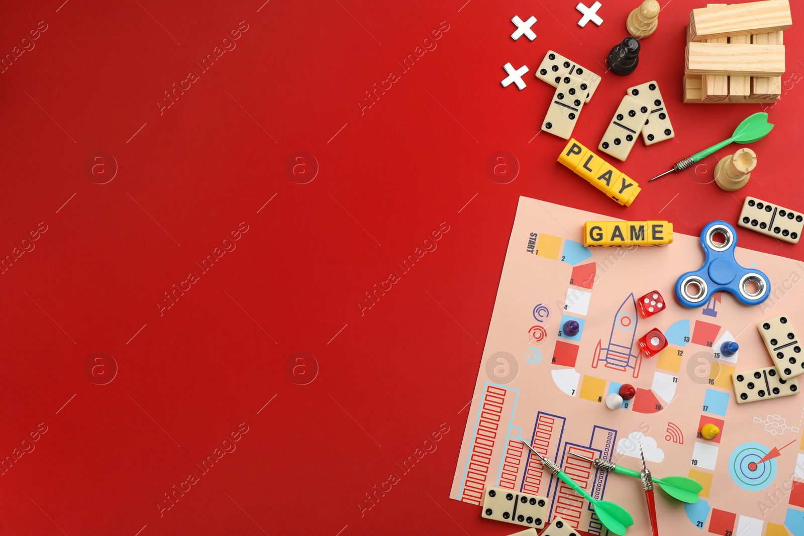 Photo of Flat lay composition of blocks with words Play Game on red background. Space for text