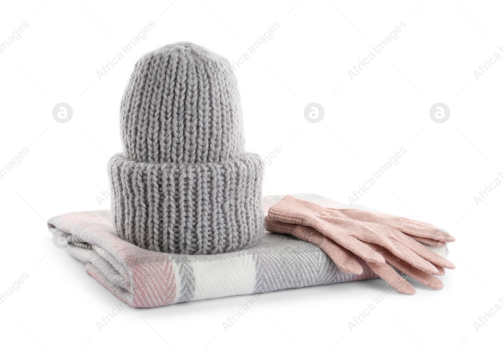 Photo of Woolen gloves, scarf and hat on white background