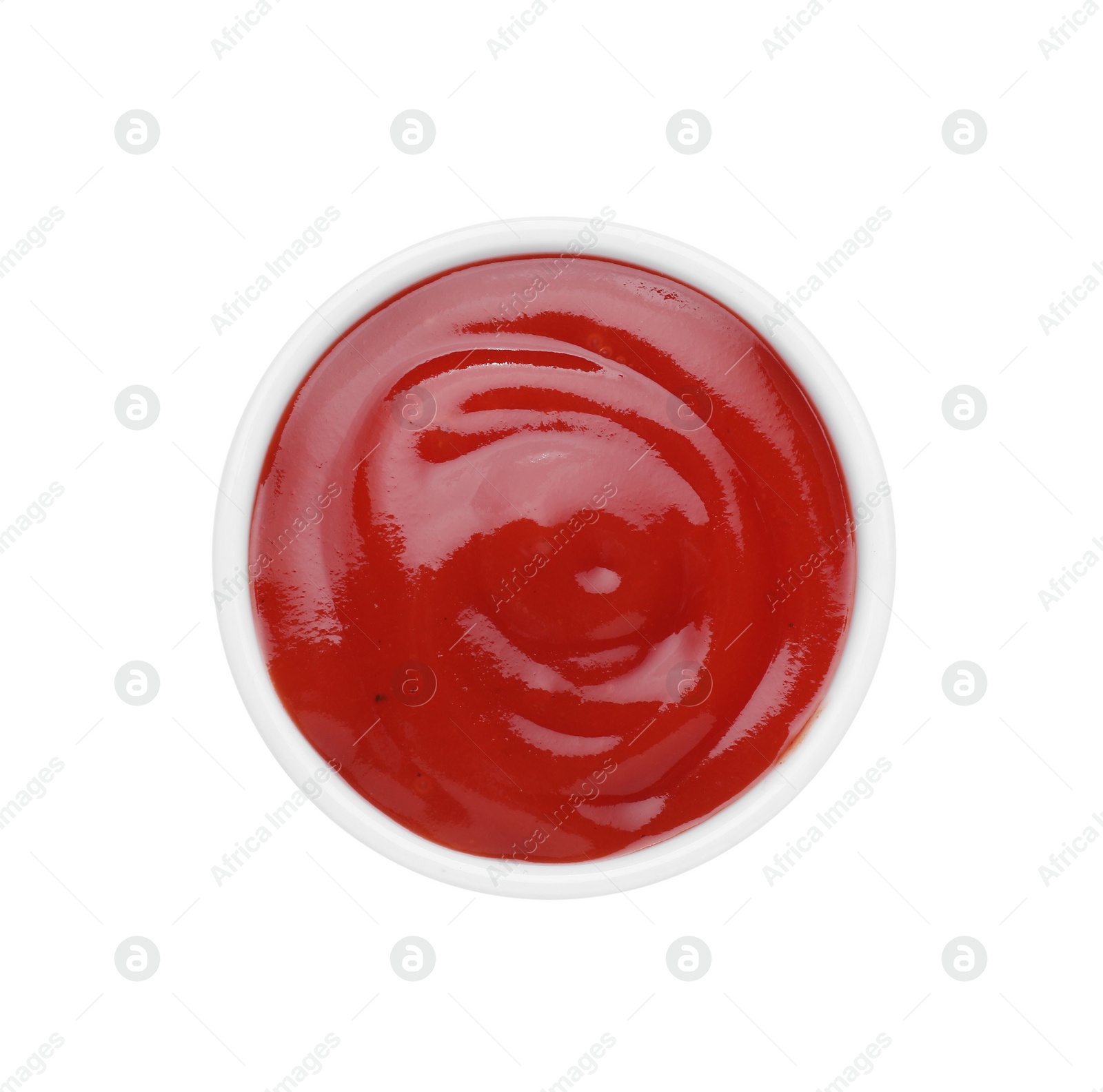 Bowl of tasty ketchup isolated on white, top view. Tomato sauce Photo of Bowl of tasty ketchup isolated on white, top view. Tomato sauce