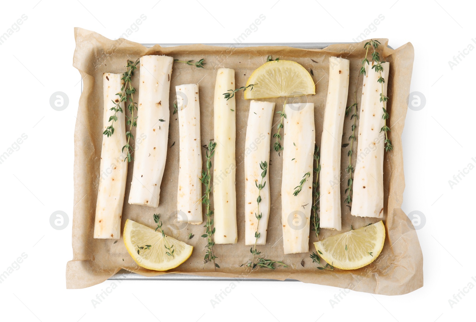 Photo of Baking tray with raw salsify roots, lemon and thyme isolated on white, top view