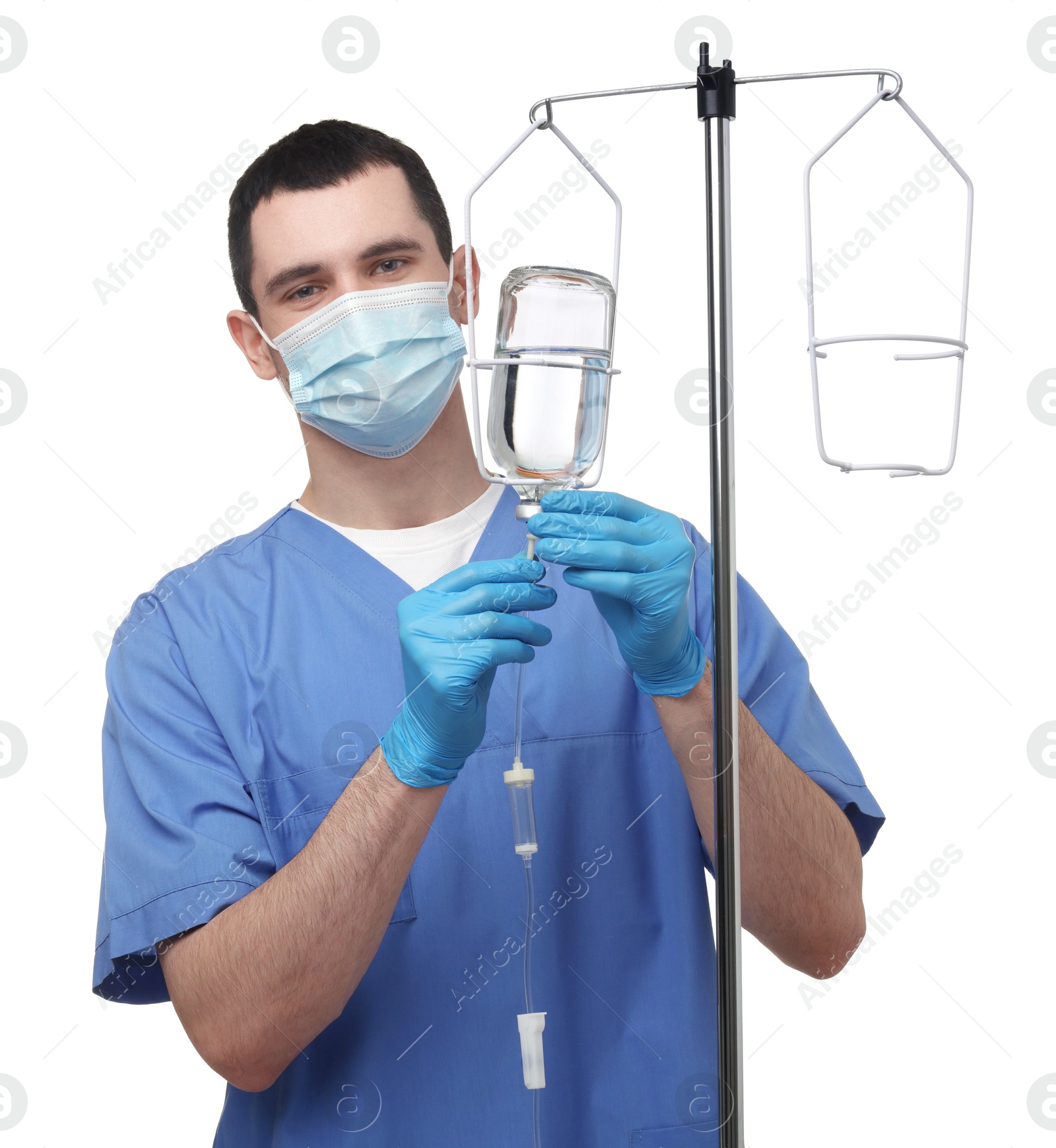 Photo of Nurse setting up IV drip on white background