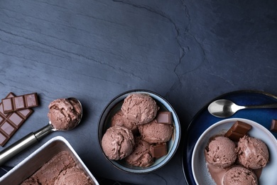 Yummy chocolate ice cream served on black table, flat lay. Space for text