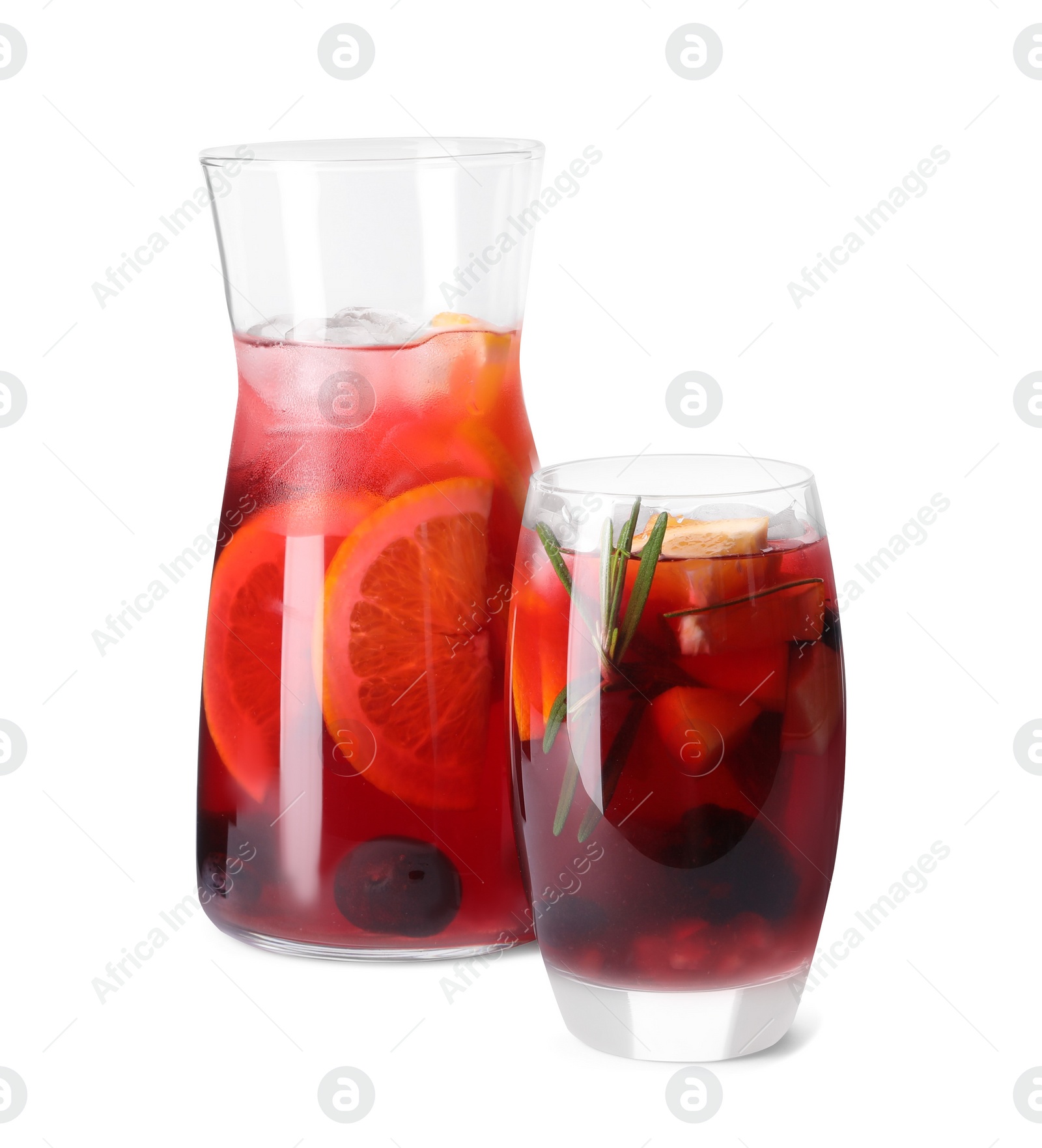 Photo of Jug and glass of delicious sangria isolated on white