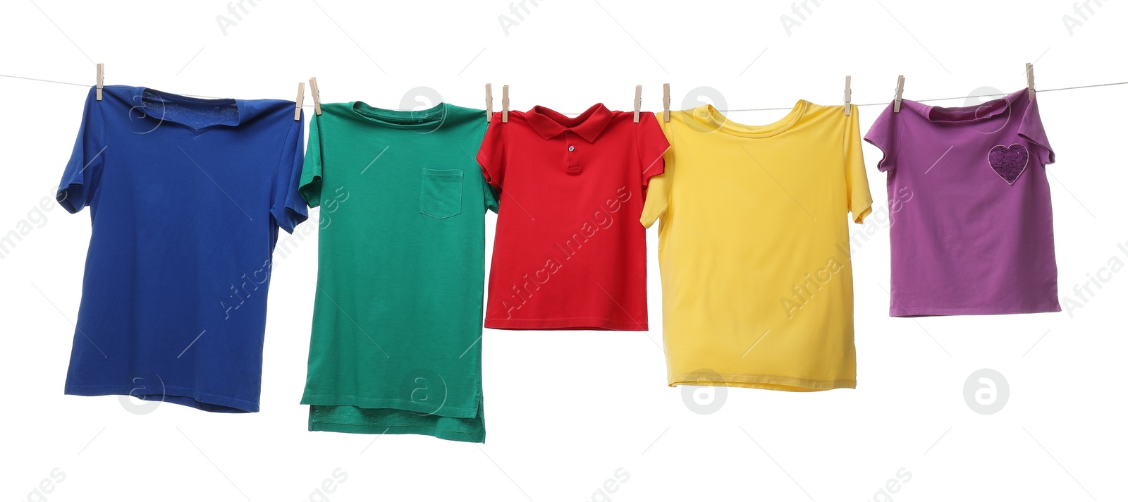 Photo of Colorful t-shirts drying on washing line isolated on white