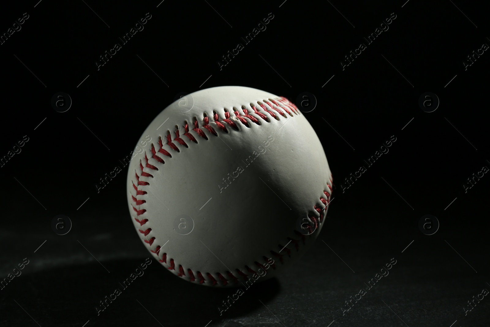 Photo of Baseball ball on black background. Sports game