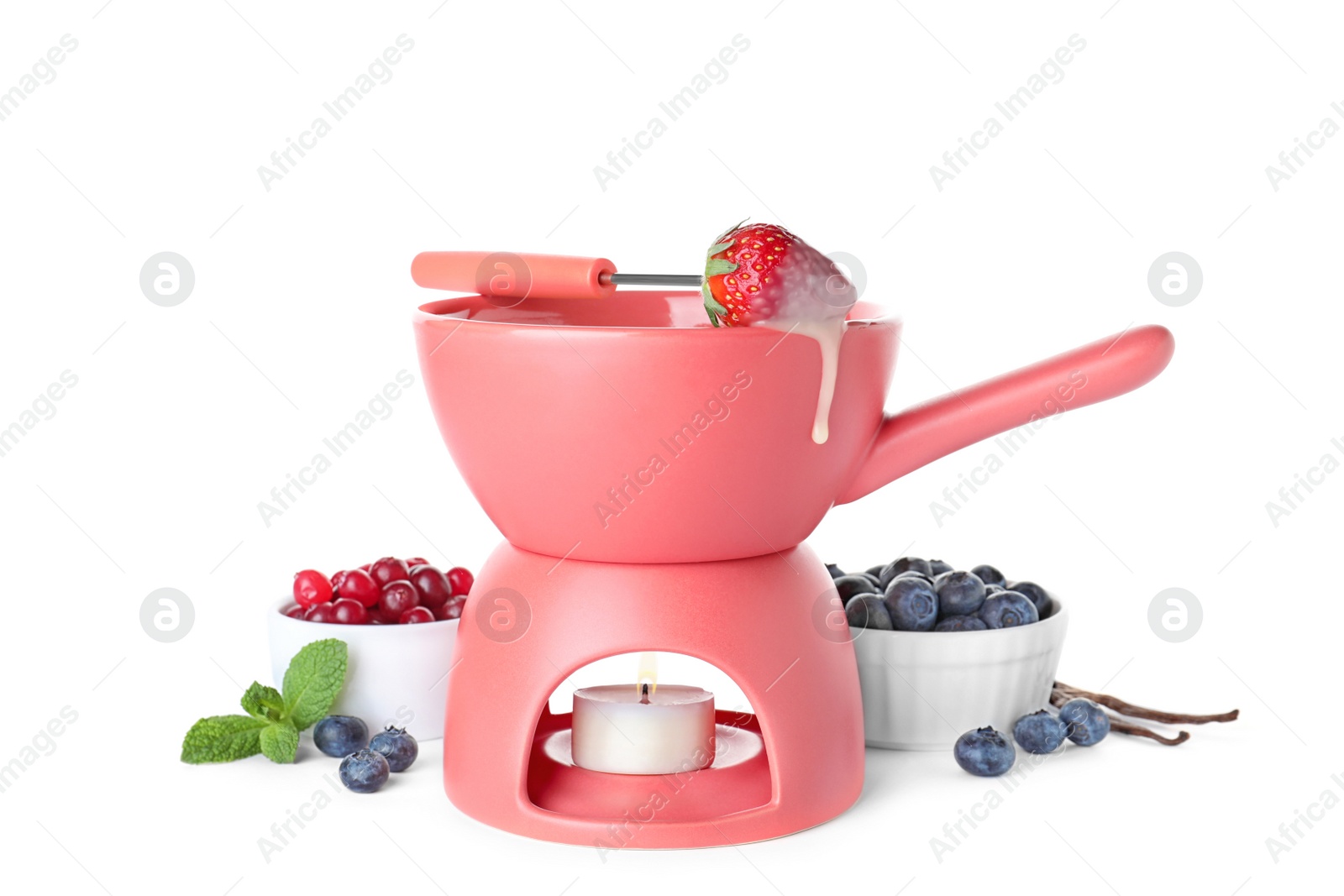 Photo of Fondue pot with chocolate and berries isolated on white