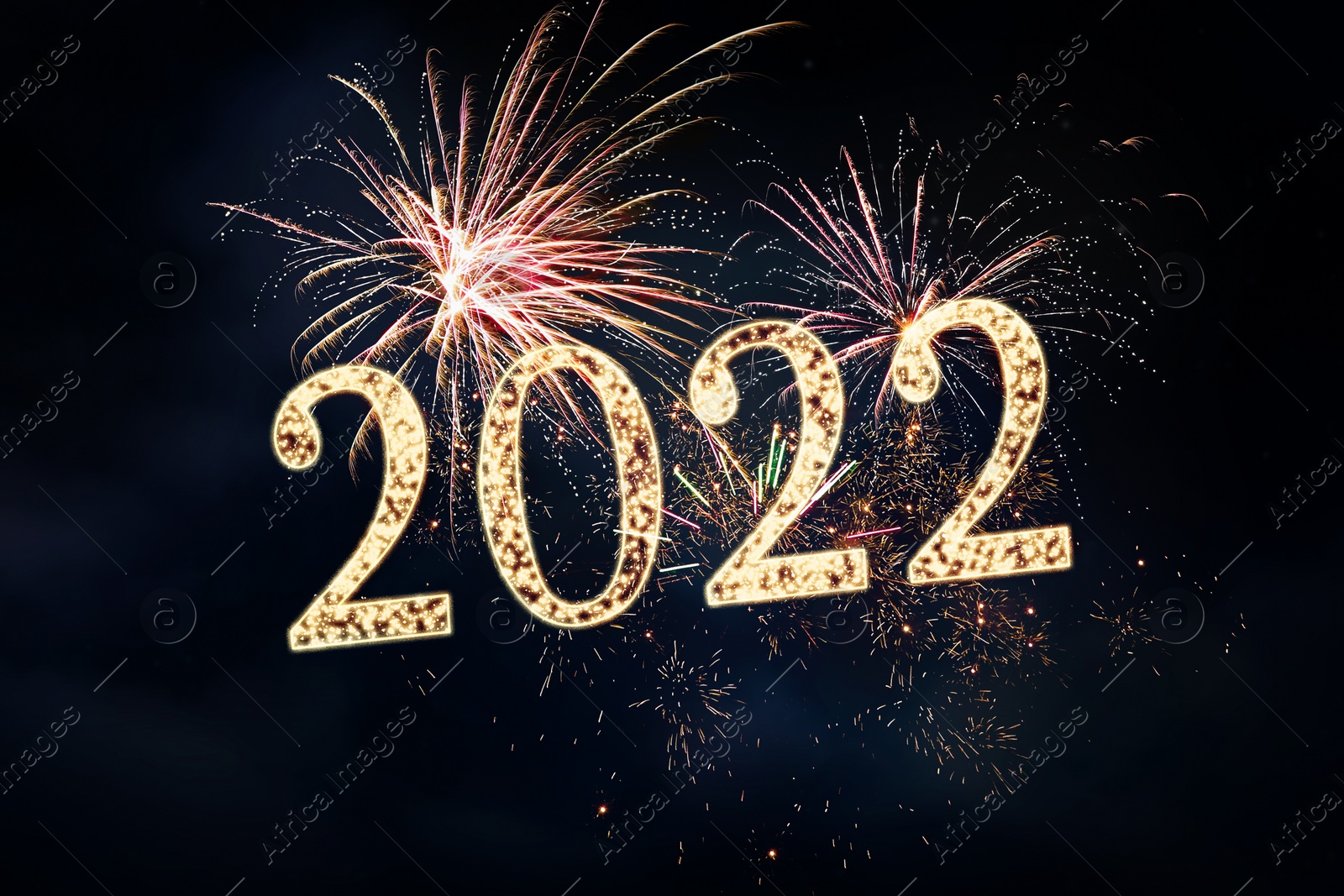 Image of Happy New Year greeting card design. 2022 silhouettes made of fireworks 