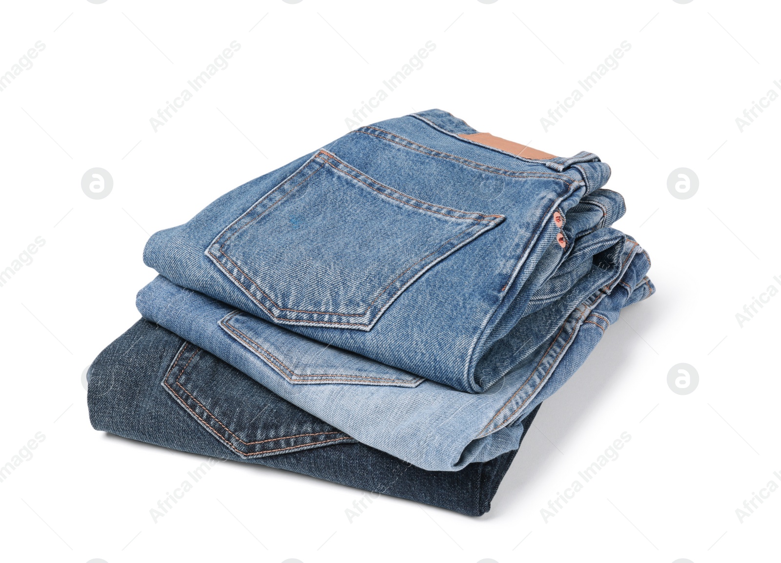 Image of Stack of different folded jeans isolated on white