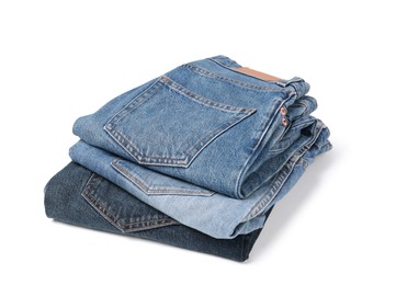 Image of Stack of different folded jeans isolated on white