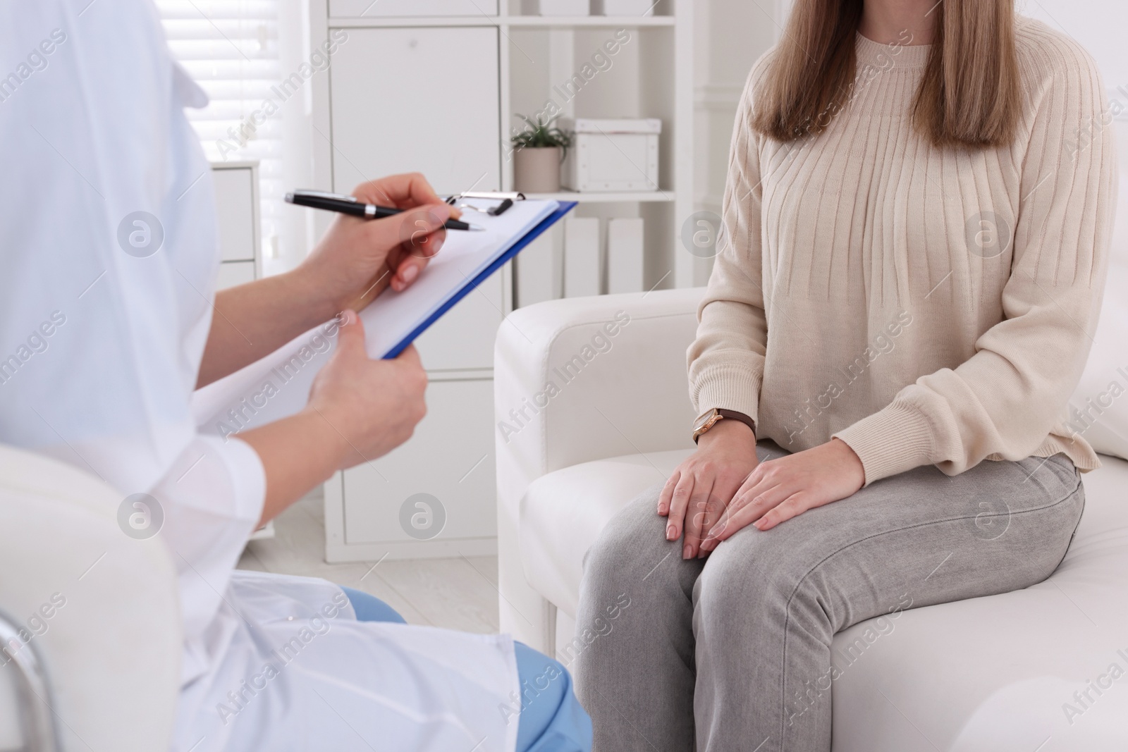 Photo of Young woman having appointment with STD specialist in clinic, closeup