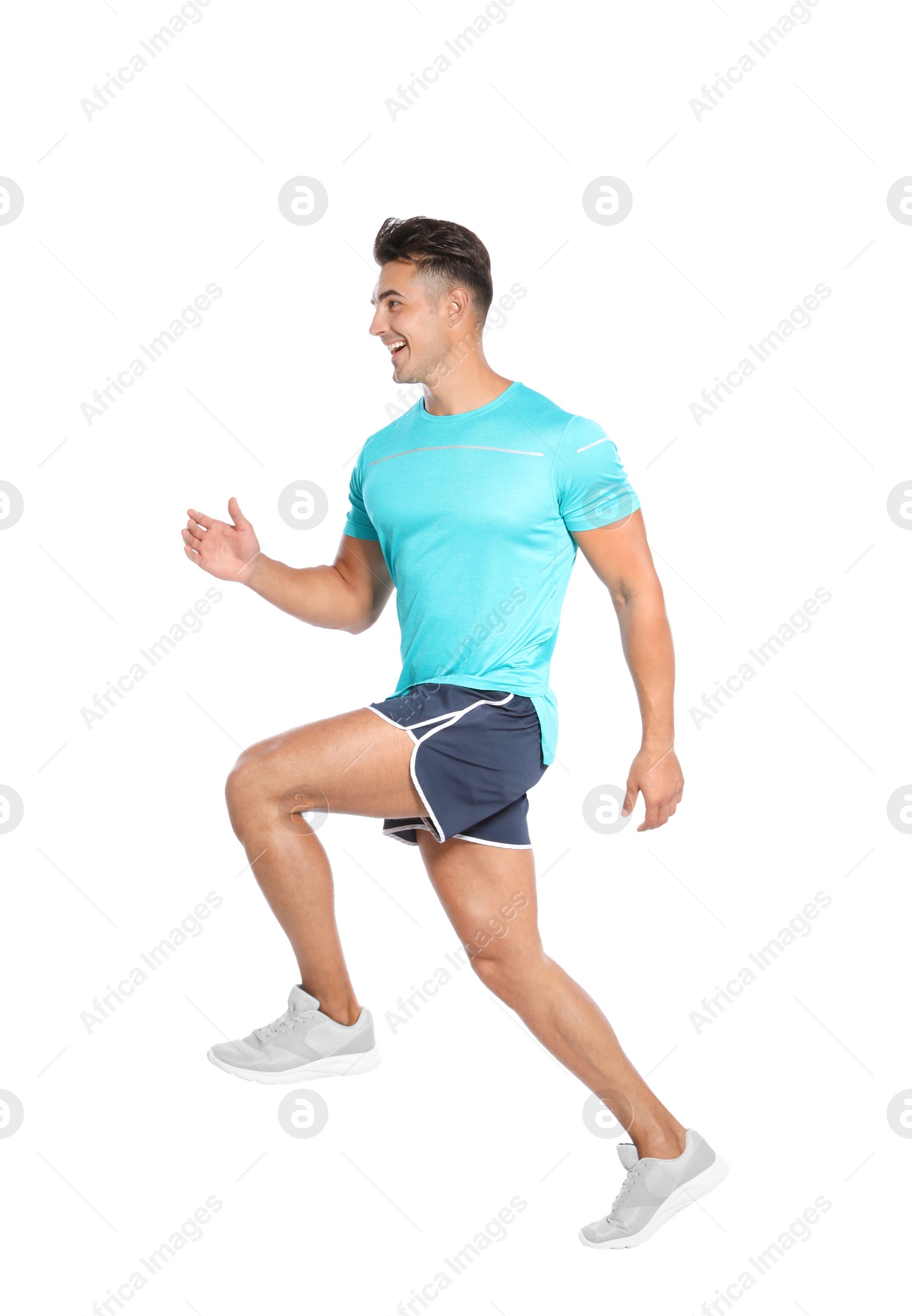 Photo of Handsome young man running on white background