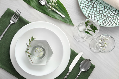 Elegant festive setting on white wooden table, flat lay