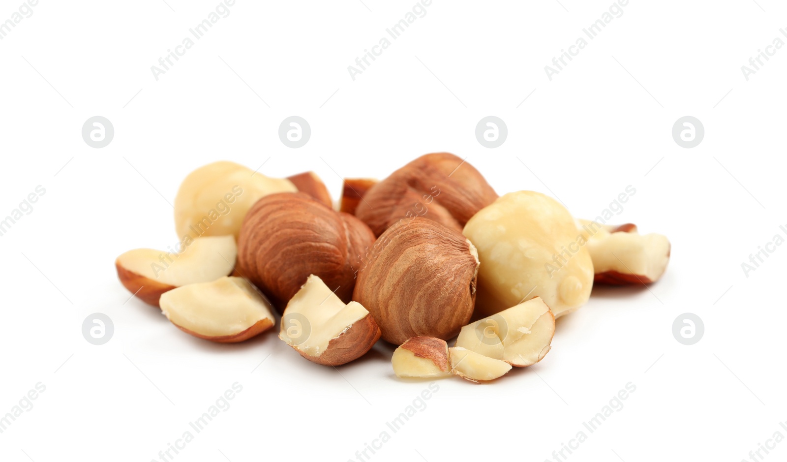 Photo of Heap of tasty hazelnuts on white background