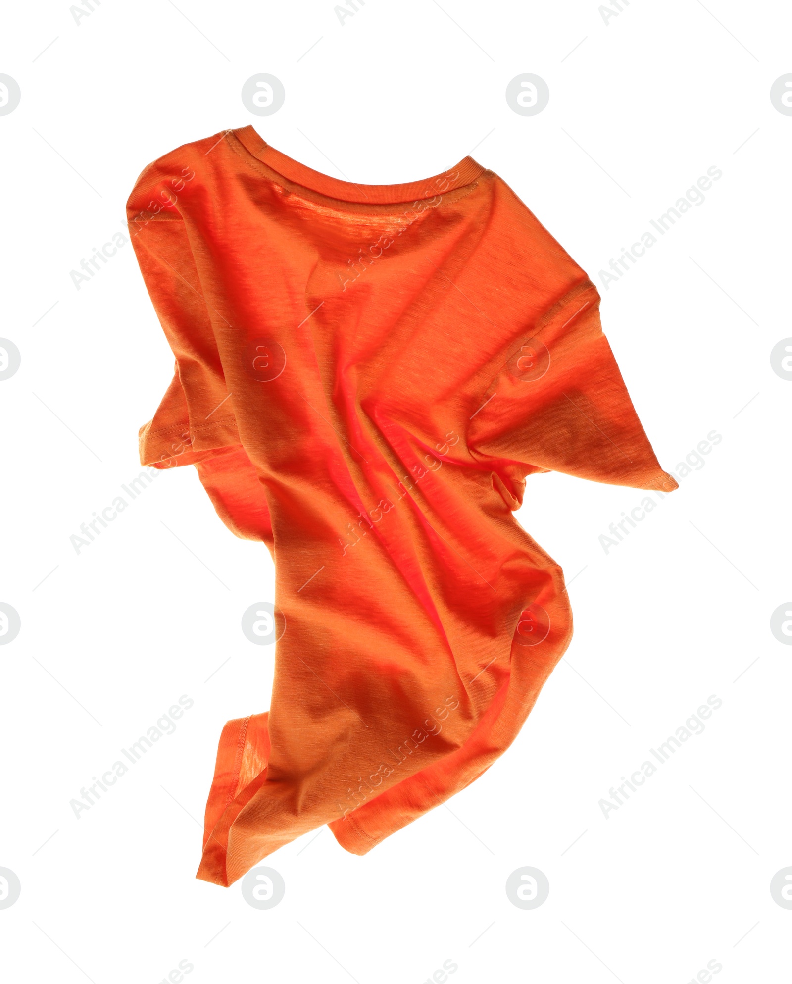 Photo of Rumpled orange t-shirt isolated on white. Messy clothes