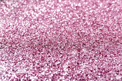 Texture of rose gold glitter as background, closeup