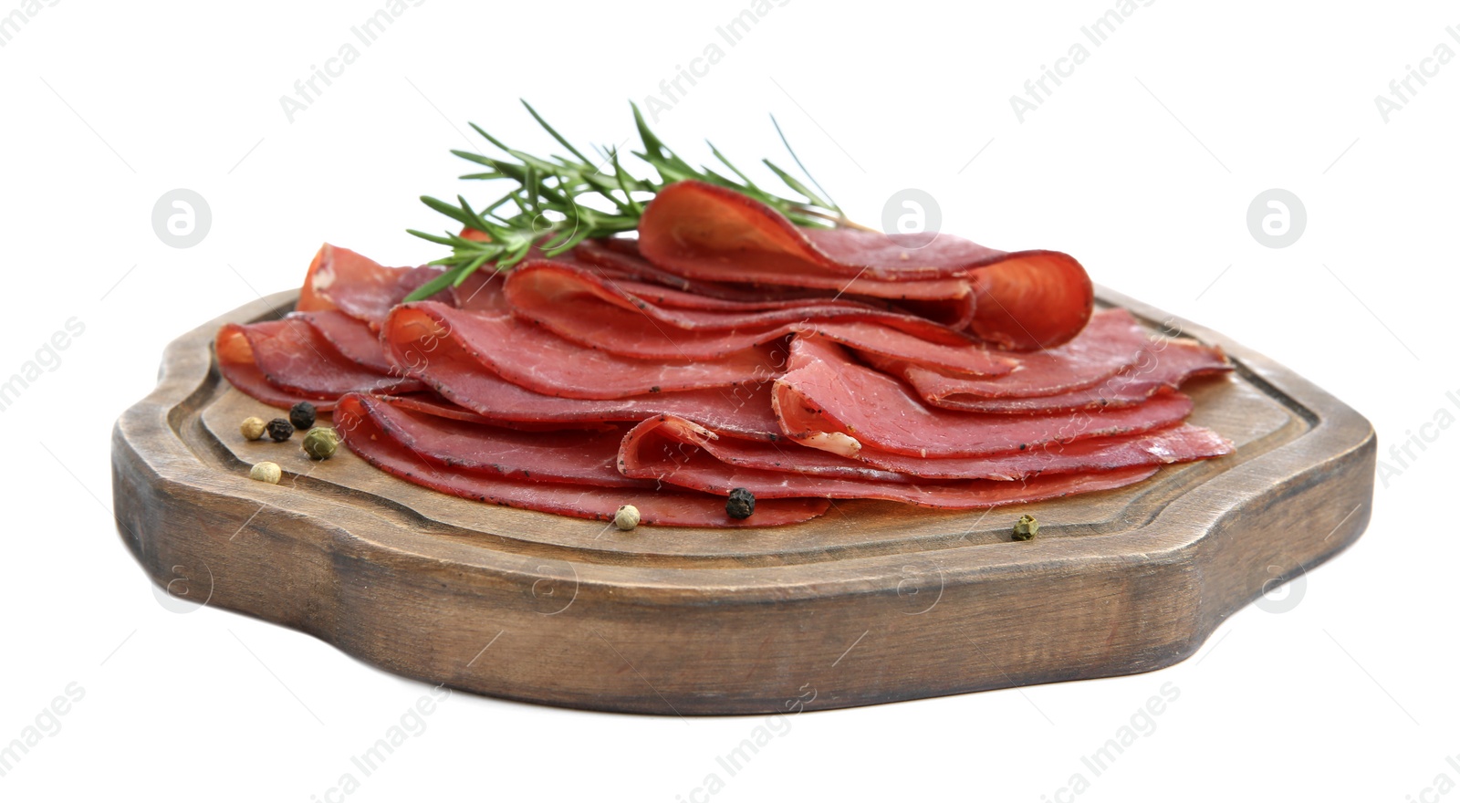 Photo of Slices of tasty bresaola, peppercorns and rosemary isolated on white