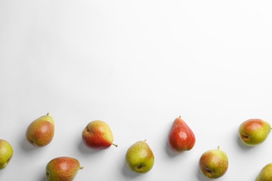 Ripe juicy pears on white background, top view