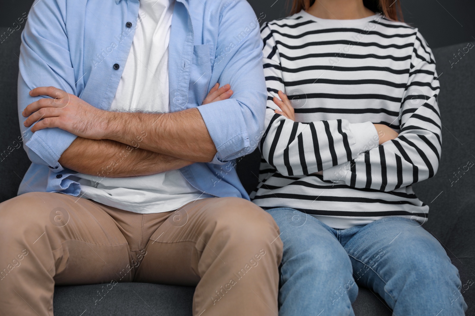 Photo of Stubborn man and woman with problems in relationship at home, closeup