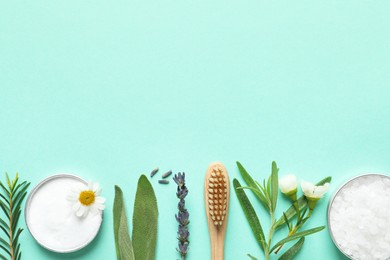 Photo of Flat lay composition with bamboo toothbrush, flowers and herbs on turquoise background. Space for text