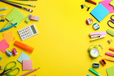Photo of School stationery on yellow background, flat lay with space for text. Back to school