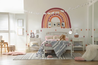 Stylish child's room interior with comfortable bed