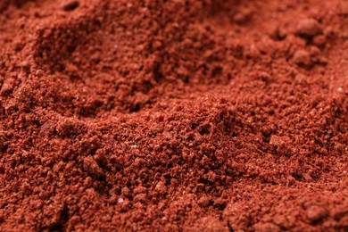 Bright cranberry powder as background, closeup view