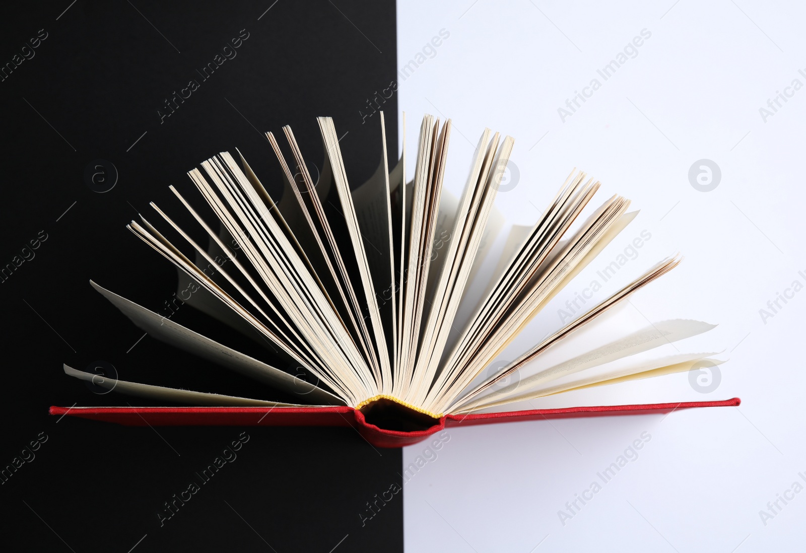Photo of Hardcover book on color background, top view