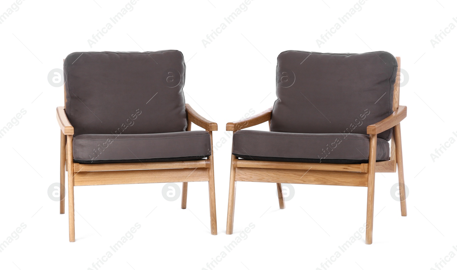 Photo of Comfortable armchairs isolated on white. Interior element