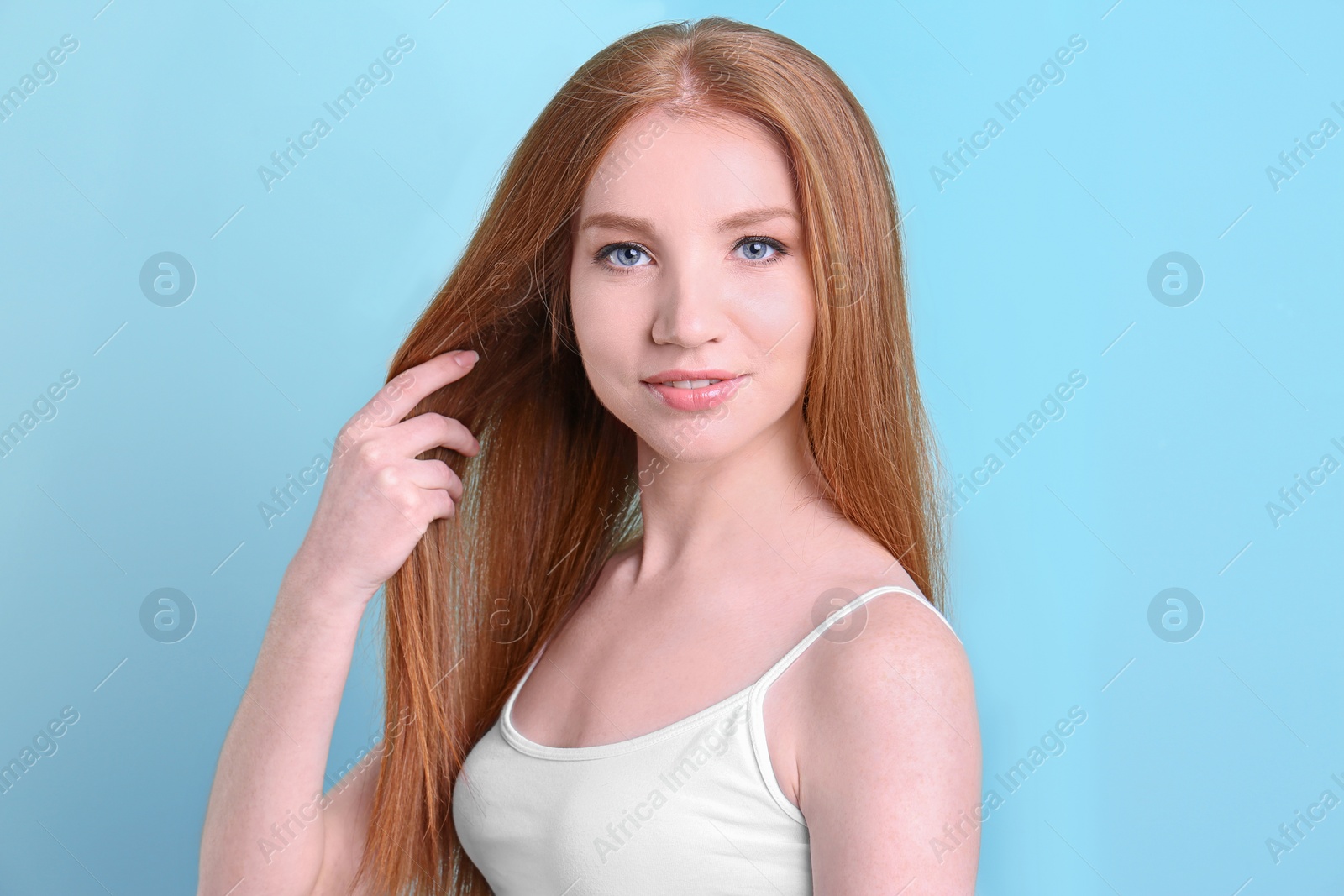 Photo of Portrait of young model with beautiful  hair on color background