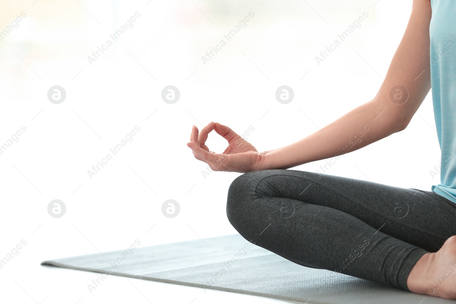 Photo of Beautiful woman meditating indoors, space for text. Zen yoga