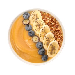 Photo of Delicious smoothie bowl with fresh blueberries, banana and granola on white background, top view