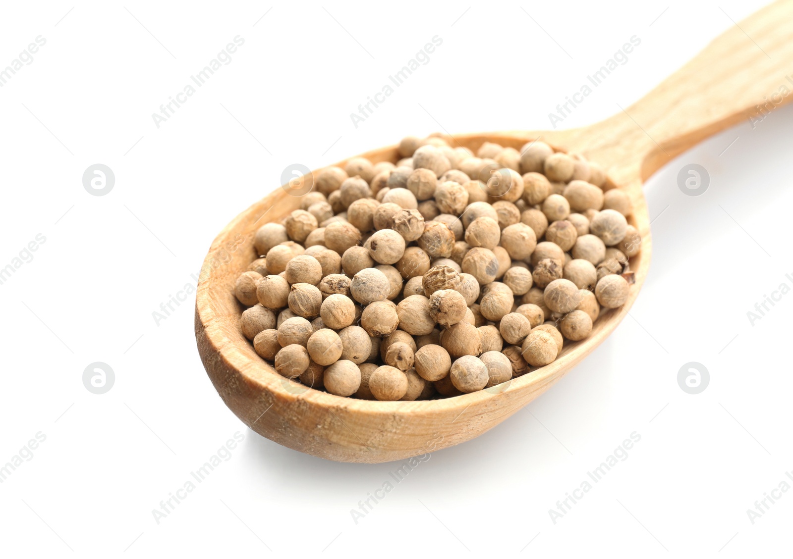 Photo of Wooden spoon with pepper grains on white background