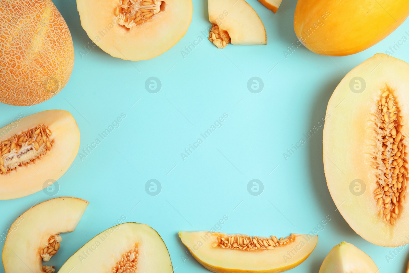 Photo of Frame made of melons with space for text on color background