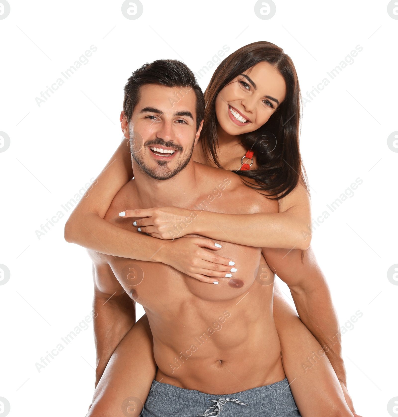 Photo of Young attractive couple in beachwear on white background