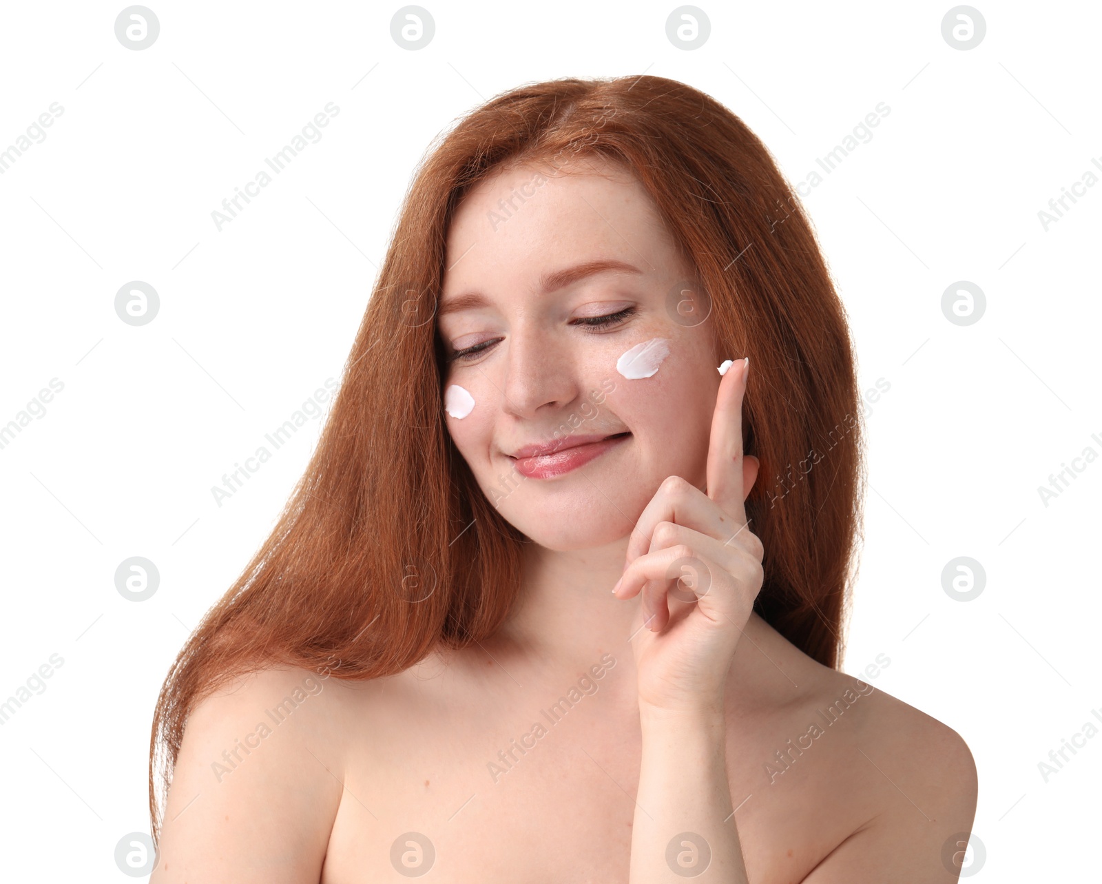 Photo of Beautiful woman with freckles and cream on her face against white background