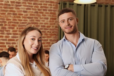 Photo of Portrait of happy employees in office. Team work