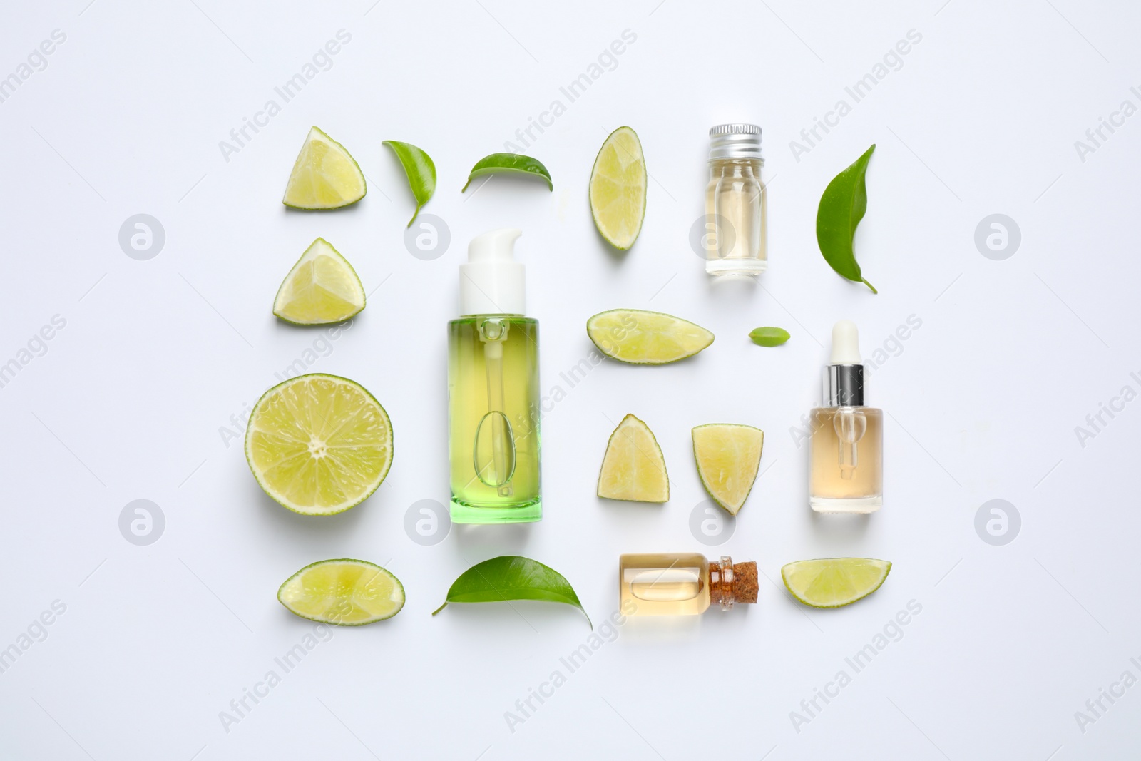 Photo of Composition with lime essential oil on white background, top view