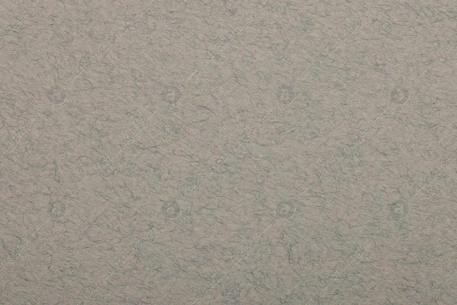 Photo of Texture of light grey paper sheet as background, top view